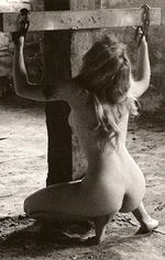 Woman chained to crossbeam